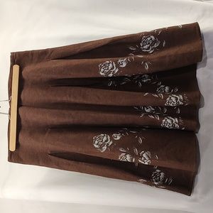 Women's brown lined skirt with white florals by Jones New York. Size 10